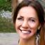Profile photo of Sarah L., a Caucasian woman in her late 40s with a warm smile, wearing activewear.